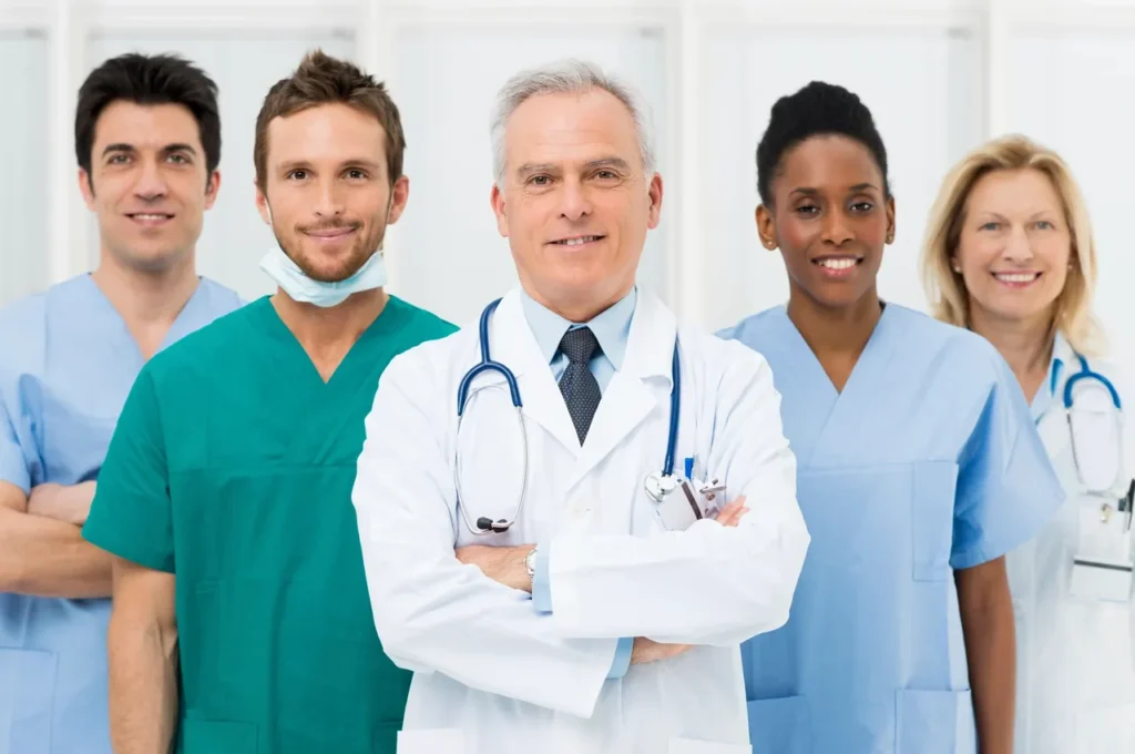 A group of doctors and nurses standing together.