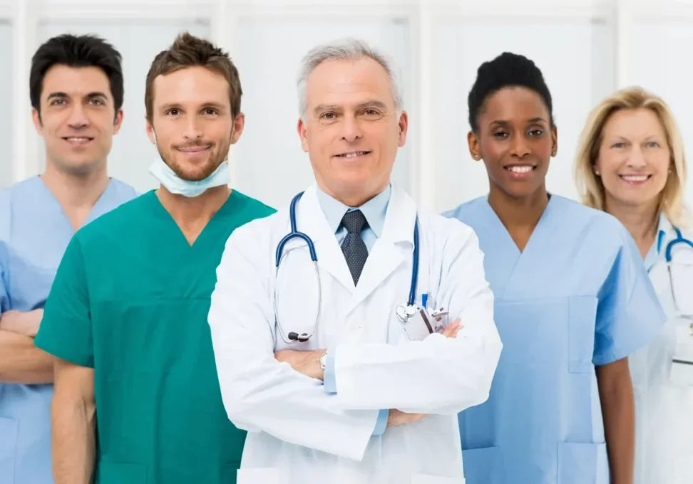 A group of doctors and nurses standing together.